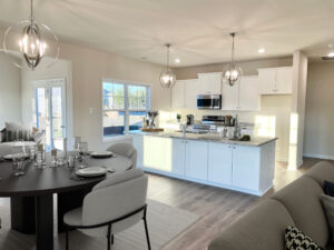 Photo of the furnished dining room and kitchen inside the Juniper Lot 46 Section 6 Castleton in Henrico VA